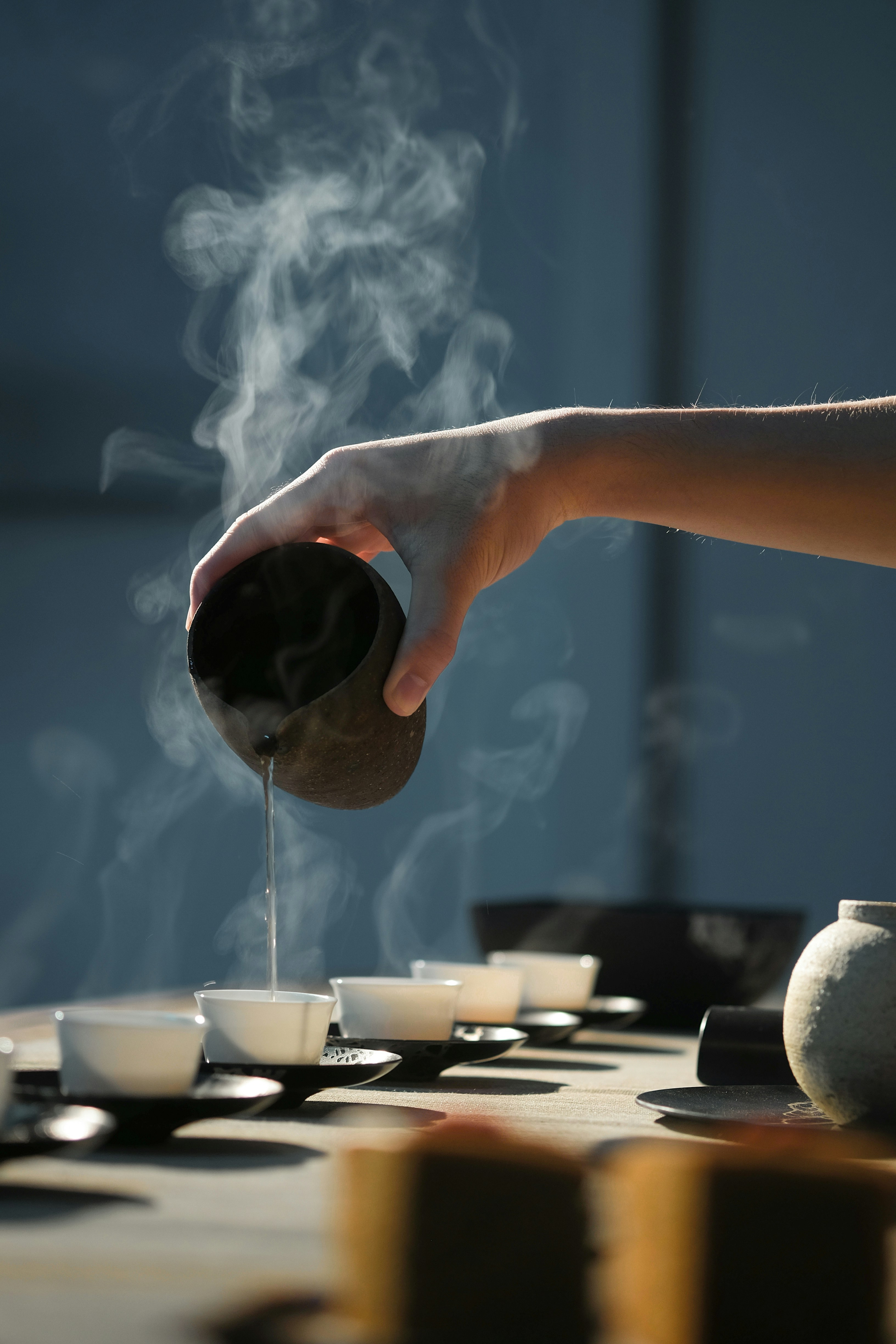 Pouring tea into a cup